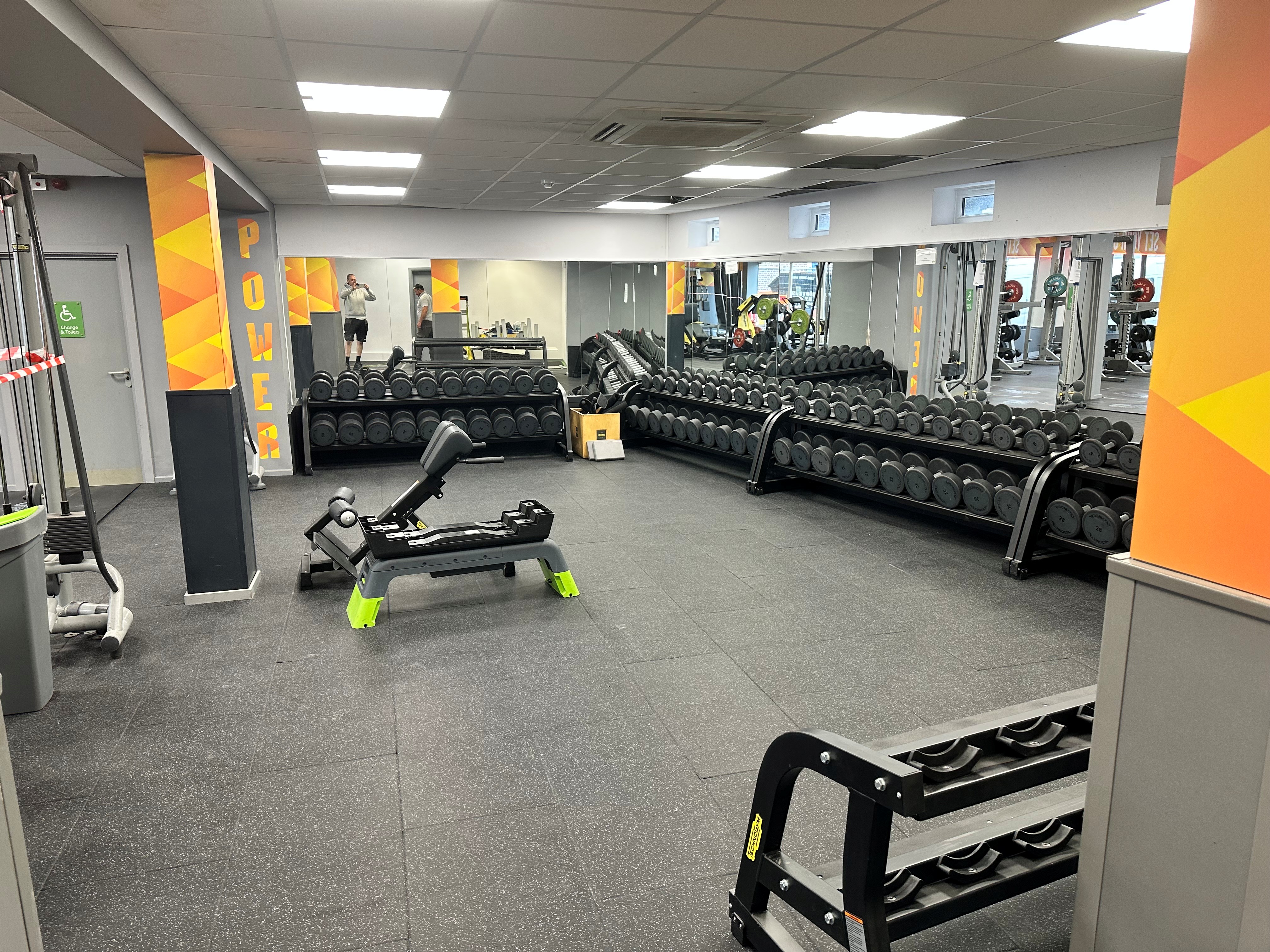 Gym free weights area with dumbbell racks